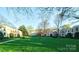 Apartment buildings with lawns and mature trees at 1121 Myrtle Ave # 17, Charlotte, NC 28203
