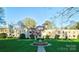 Apartment complex with well-manicured lawn and colorful trees in a park-like setting at 1121 Myrtle Ave # 17, Charlotte, NC 28203
