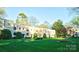 Beautiful exterior of the two-story building with manicured lawn and mature trees at 1121 Myrtle Ave # 17, Charlotte, NC 28203