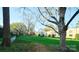 A manicured lawn and mature trees surround the property with distant city views at 1121 Myrtle Ave # 17, Charlotte, NC 28203