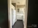 Compact kitchen featuring white cabinets and appliances at 1121 Myrtle Ave # 17, Charlotte, NC 28203