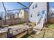 Charming backyard with a wooden pergola and a stone firepit, perfect for entertaining and relaxation at 12304 Huntersville Concord Rd, Huntersville, NC 28078