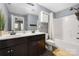 Bathroom featuring double sinks, a shower-tub combo, and vanity with storage at 12304 Huntersville Concord Rd, Huntersville, NC 28078