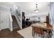 Open-concept design showcasing the dining room, stairs, and kitchen at 12304 Huntersville Concord Rd, Huntersville, NC 28078