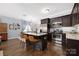 Modern kitchen with an island, stainless steel appliances, and an open layout to the living area at 12304 Huntersville Concord Rd, Huntersville, NC 28078