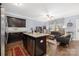 Open-concept living and kitchen area with modern appliances and an island with bar seating at 12304 Huntersville Concord Rd, Huntersville, NC 28078