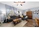 Comfortable living room with hardwood floors, modern furniture, and large windows with natural light at 12304 Huntersville Concord Rd, Huntersville, NC 28078