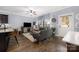 Open-concept living room with hardwood floors, comfortable seating, and access to the outdoor area at 12304 Huntersville Concord Rd, Huntersville, NC 28078