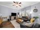 Comfortable living room with hardwood floors, modern furniture, and a TV entertainment center at 12304 Huntersville Concord Rd, Huntersville, NC 28078