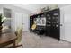 Inviting office space featuring a desk, sofa, shelving, and carpeted floor at 12304 Huntersville Concord Rd, Huntersville, NC 28078
