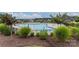 Community pool with plenty of lounge chairs and leafy foliage surrounding the perimeter at 12304 Huntersville Concord Rd, Huntersville, NC 28078