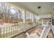 Inviting covered porch with rocking chairs, offering a relaxing outdoor space at 12304 Huntersville Concord Rd, Huntersville, NC 28078