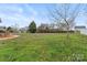 Large, grassy backyard with mature trees and partial fencing at 1278 Gracebrook Dr, Salisbury, NC 28147