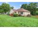 A spacious, green backyard featuring a wooden deck and fence at 1278 Gracebrook Dr, Salisbury, NC 28147