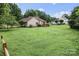 A large backyard with a deck and lush green lawn at 1278 Gracebrook Dr, Salisbury, NC 28147