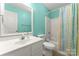 Bright bathroom featuring a shower with colorful curtains and a white vanity at 1278 Gracebrook Dr, Salisbury, NC 28147