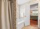 Bathroom showcasing a bathtub with shower and doorway to the bedroom at 1278 Gracebrook Dr, Salisbury, NC 28147