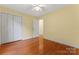 Spacious bedroom featuring hardwood floors, a ceiling fan, and closet at 1278 Gracebrook Dr, Salisbury, NC 28147