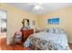 Bedroom with yellow walls, wood dresser, hardwood floors and a bed at 1278 Gracebrook Dr, Salisbury, NC 28147