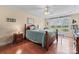 Comfortable bedroom with a tray ceiling, wood furniture, hardwood floors and a bright window at 1278 Gracebrook Dr, Salisbury, NC 28147
