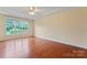 Bright bedroom featuring hardwood floors and a large window with nature views at 1278 Gracebrook Dr, Salisbury, NC 28147