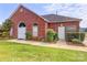 Charming brick clubhouse with arched entryways, lush landscaping, and a welcoming atmosphere for community gatherings at 1278 Gracebrook Dr, Salisbury, NC 28147