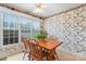Cozy dining area featuring a wood table, chairs, and natural light from a large window at 1278 Gracebrook Dr, Salisbury, NC 28147