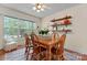 Charming dining room with wood table, chairs, decorative shelves, and natural light from the large window at 1278 Gracebrook Dr, Salisbury, NC 28147