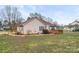 Exterior backyard view featuring a patio and manicured lawn at 1278 Gracebrook Dr, Salisbury, NC 28147