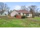 Back exterior view showing deck, yard, and flowering ground cover at 1278 Gracebrook Dr, Salisbury, NC 28147