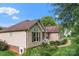 Well-maintained home displaying manicured landscaping, a charming facade, and a walkway amid lush greenery at 1278 Gracebrook Dr, Salisbury, NC 28147