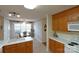 Well-lit kitchen with vintage wood cabinets, an adjacent dining room, and an airy atmosphere at 1278 Gracebrook Dr, Salisbury, NC 28147