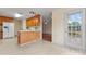 Cozy kitchen featuring wooden cabinets and a view of the outdoors with access to the backyard area at 1278 Gracebrook Dr, Salisbury, NC 28147