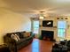 Spacious living room featuring a fireplace, hardwood floors and natural light at 1278 Gracebrook Dr, Salisbury, NC 28147