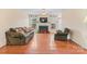 Bright living room with a fireplace, hardwood floors, and comfortable seating at 1278 Gracebrook Dr, Salisbury, NC 28147