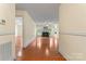 Spacious living area with hardwood floors, a fireplace, and abundant natural light, creating an inviting space at 1278 Gracebrook Dr, Salisbury, NC 28147