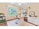 Sunlit office with a ceiling fan, large window, built-in shelves and desk, and neutral colors at 1278 Gracebrook Dr, Salisbury, NC 28147