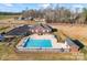 Aerial view of a community pool with sundeck, seating, and easy access to parking and playground at 1278 Gracebrook Dr, Salisbury, NC 28147
