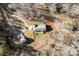 A bird's-eye view captures the layout of the house, outbuildings, and surrounding yard at 1298 Hines Rd, Clover, SC 29710