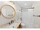 Bright bathroom features granite counters, modern fixtures, and a tub shower combination at 1298 Hines Rd, Clover, SC 29710