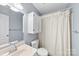 Bathroom with modern fixtures and white cabinets, complemented by a well-lit vanity at 1298 Hines Rd, Clover, SC 29710