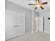 Bedroom with carpet, ceiling fan, double door closet, and neutral paint at 1298 Hines Rd, Clover, SC 29710