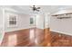 Bright and spacious bedroom with tray ceiling, hardwood floors, and large windows at 1298 Hines Rd, Clover, SC 29710