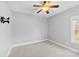 Bedroom with neutral paint, ceiling fan, carpet, and window offering natural light at 1298 Hines Rd, Clover, SC 29710