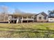 Charming one-story home with a covered porch and a well-manicured lawn at 1298 Hines Rd, Clover, SC 29710