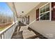 Spacious front porch with a view to the outdoor landscape at 1298 Hines Rd, Clover, SC 29710