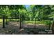 A gated entrance to a pasture or wooded area, enhancing the property's privacy and potential at 1298 Hines Rd, Clover, SC 29710