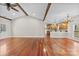 Open-concept living room with hardwood floors and exposed beam ceiling at 1298 Hines Rd, Clover, SC 29710