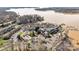 Overhead perspective of lakeside condos with amenities including a pool and marina at 13913 Queens Harbor Rd, Charlotte, NC 28278