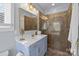 Bathroom with a glass-enclosed shower, sleek vanity, and modern lighting, providing a spa-like experience at 13913 Queens Harbor Rd, Charlotte, NC 28278